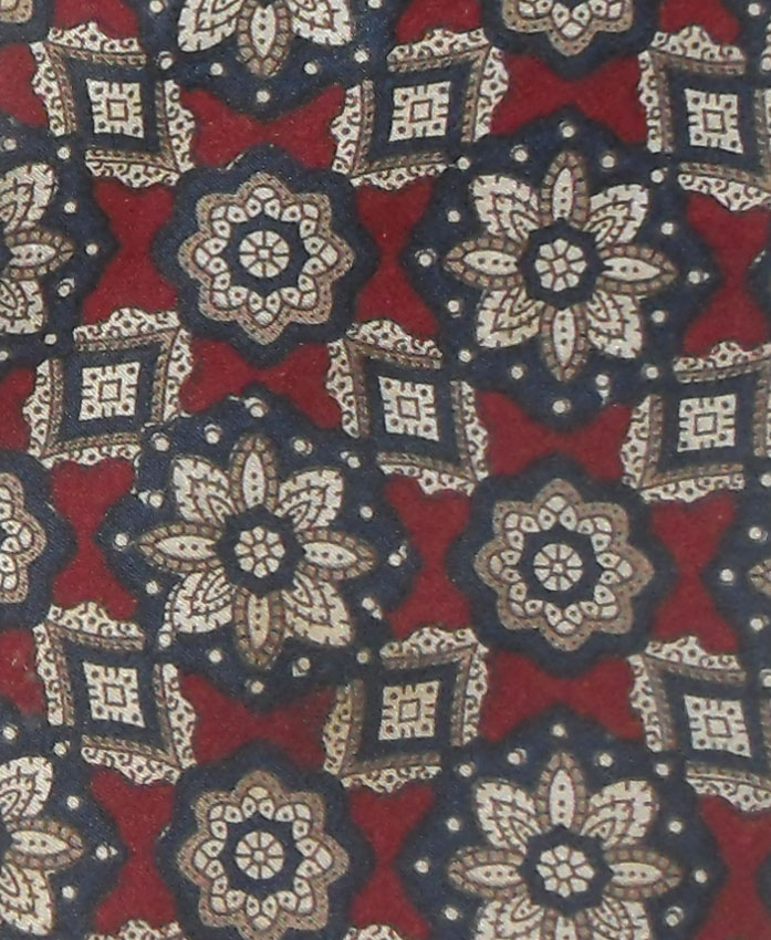 Vintage Lanvin silk tie with a floral deisgn in dark blue and taupe on a dark red background