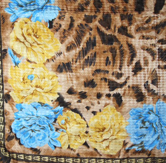 Animal print textured silk scarf with a blue and yellow flower design