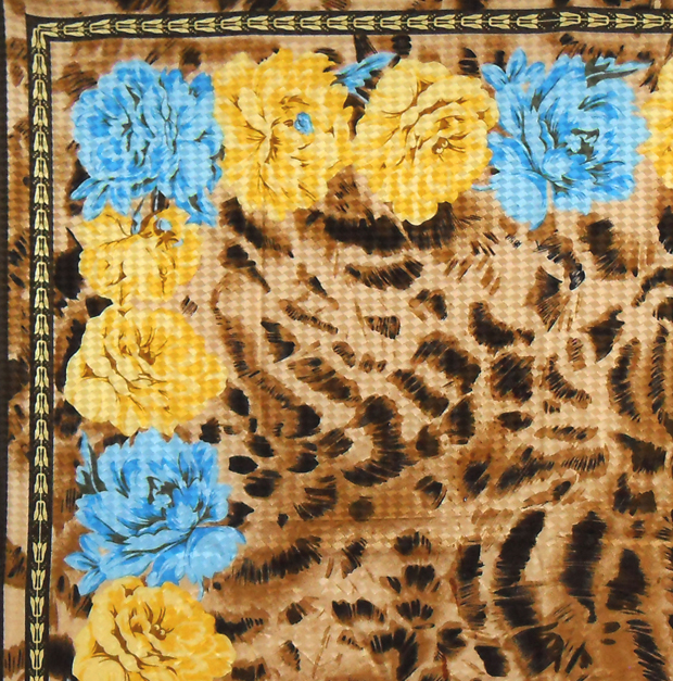 Animal print textured silk scarf with a blue and yellow flower design