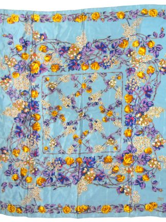 Liberty silk scarf with a light blue background and a vibrant floral design