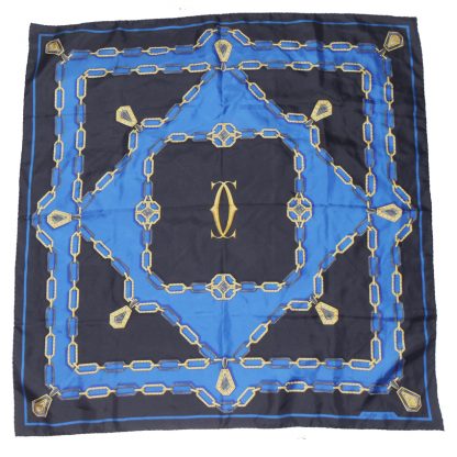 Cartier Silk scarf in a blue, black and gold design with the logo in the centre
