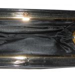 Black patent clutch bag with gold tone frame and clasp