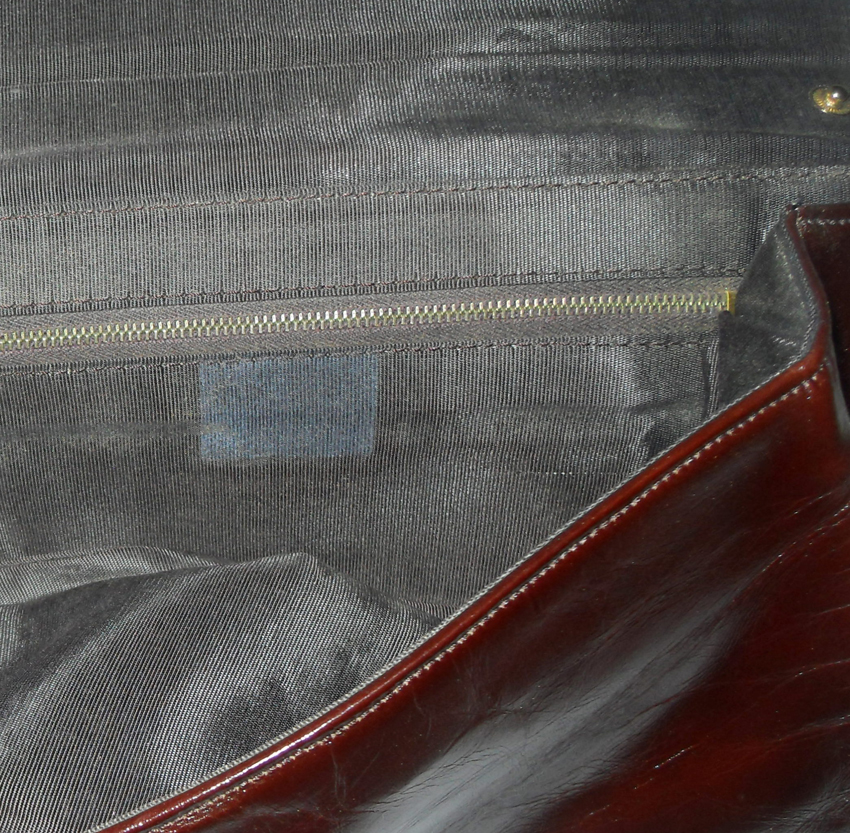 Retro brown snakeskin and leather clutch bag