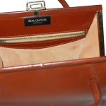 Brown leather framed handbag