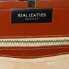 Brown leather framed handbag