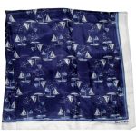 Sheer silk scarf with a design of sail boats on a dark blue background