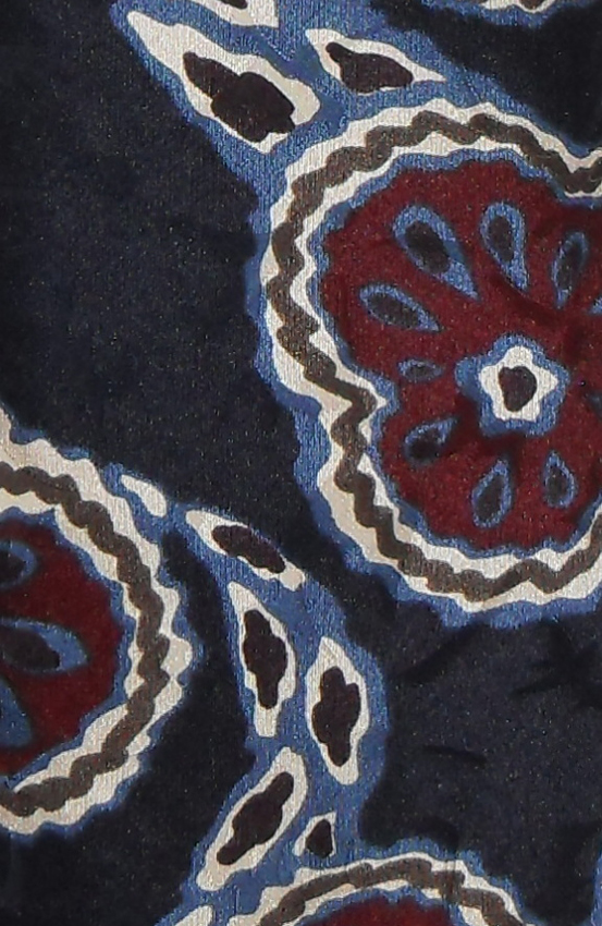 Vibrant designer silk tie on a textured silk background