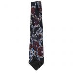 Vibrant designer silk tie on a textured silk background