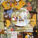 Pictorial silk scarf depicting various scenes