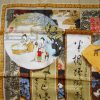 Pictorial silk scarf depicting various scenes