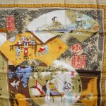 Pictorial silk scarf depicting various scenes