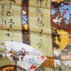 Pictorial silk scarf depicting various scenes