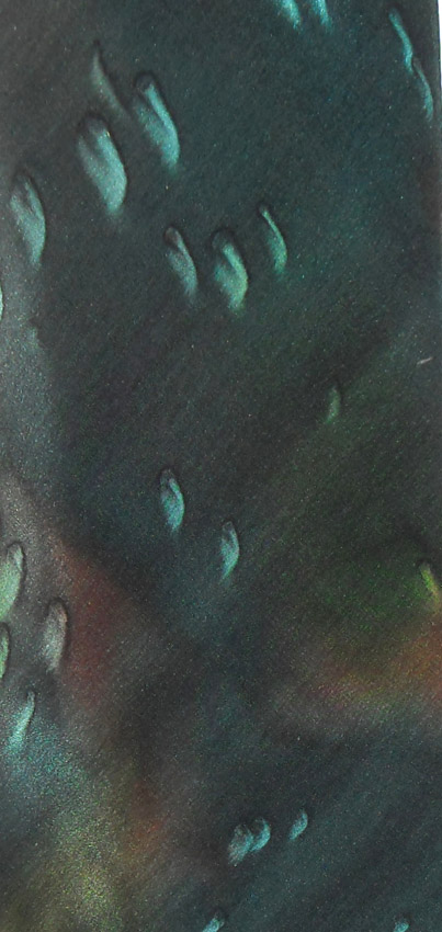 Vintage Moschino silk tie with a dark green background