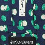 Yves Saint :Laurent green coconut on dark blue background design silk tie