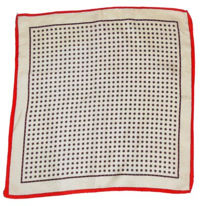 Hand rolled edge silk square with a red border and a cream and red design