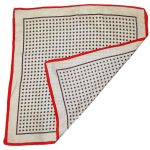 Hand rolled edge silk square with a red border and a cream and red design