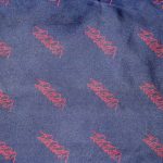 Jacqmar dark blue silk scarf with red outline of rope being pulled design