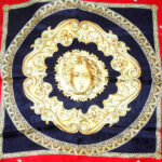 Red and gold classical design with a black border silk scarf with hand rolled edges