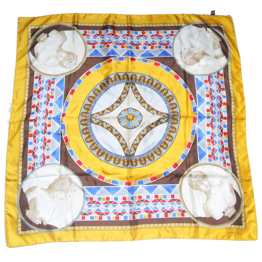 Silk scarf with hand rolled edges and a gold border with a classic central design in grey, blue and red.