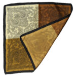 Silk pocket square with a black border and a design in brown, light and nd dark gold