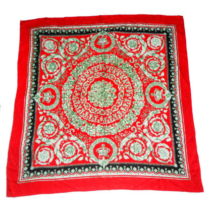 Jacquard silk scarf with a red border and central design on a red background