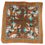 Brown silk scarf with a central design in shades of brown and turquoise blue