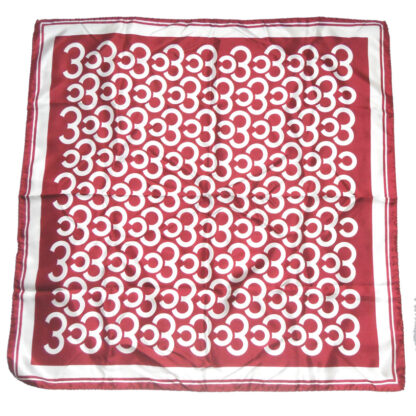 Maroon background silk scarf with a white design, hand rolled edges, made in Italy