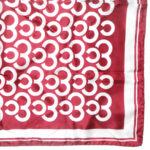 Maroon background silk scarf with a white design, hand rolled edges, made in Italy