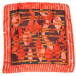 Orange and white border silk scarf wiht a central deisgn in ornage black and brown