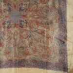 Silk scarf witha light brown border and a central dark brown paisley design