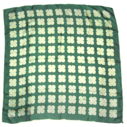 Vintage silk scarf with hand rolled edges, a dark green backgrounda nd a light green design