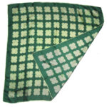 Vintage silk scarf with hand rolled edges, a dark green backgrounda nd a light green design