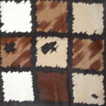 Hand rolled edge silk scarf with adesign in shades of brown and cream