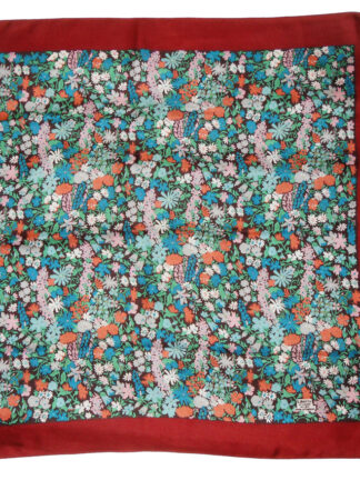 Liberty of London silk scarf with a dark red border and a central design of flowers in different colours