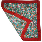 Liberty of London silk scarf with a dark red border and a central design of flowers in different colours