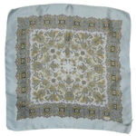 Liberty of London silk scarf with a pale blue border and background and a detailed paisley design