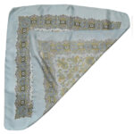 Liberty of London silk scarf with a pale blue border and background and a detailed paisley design
