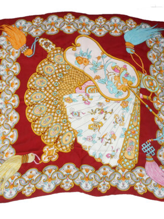 Xiang Mei fan design silk scarf with a dark red border and the central design in shades of pink, blue and gold