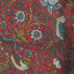 Liberty bird and flower design on a dark red background silk tie
