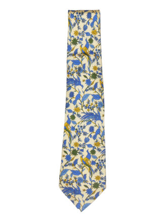 Liberty of London silk tie with a design of blue and yellow birds of Paradise and flowers on a pale yellow background