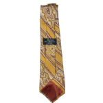 Harrods made by Michelsons All Silk tie, made in England, with a golden yellow background and a whtie and mauve design