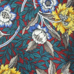Liberty silk tie with a design of yellow and white flowers on a dark green and dark red foliage background