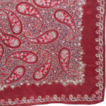 Maroon paisley and flower design scarf with rolled edges