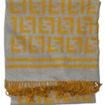 Large grey and yellow soft wool scarf with a design of the Fendi logo repeated.