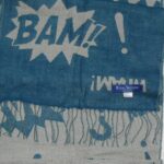 Royal Speyside merino wool blue scarf with a design of the words Bam! Pow! and Wham!