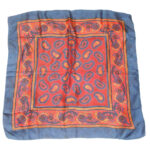 Blue border silk scarf with a red and blue paisley central design