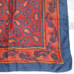 Blue border silk scarf with a red and blue paisley central design