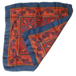 Blue border silk scarf with a red and blue paisley central design