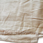 Louis Vuitton pale gold logo repeat wool shawl
