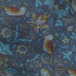 Liberty bird and flower design on a blue background silk tie